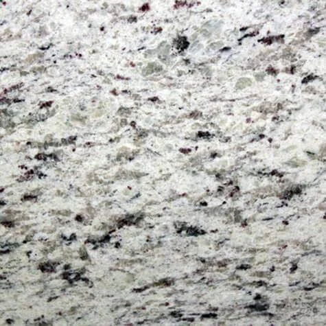 Close-up of white granite texture with speckles.