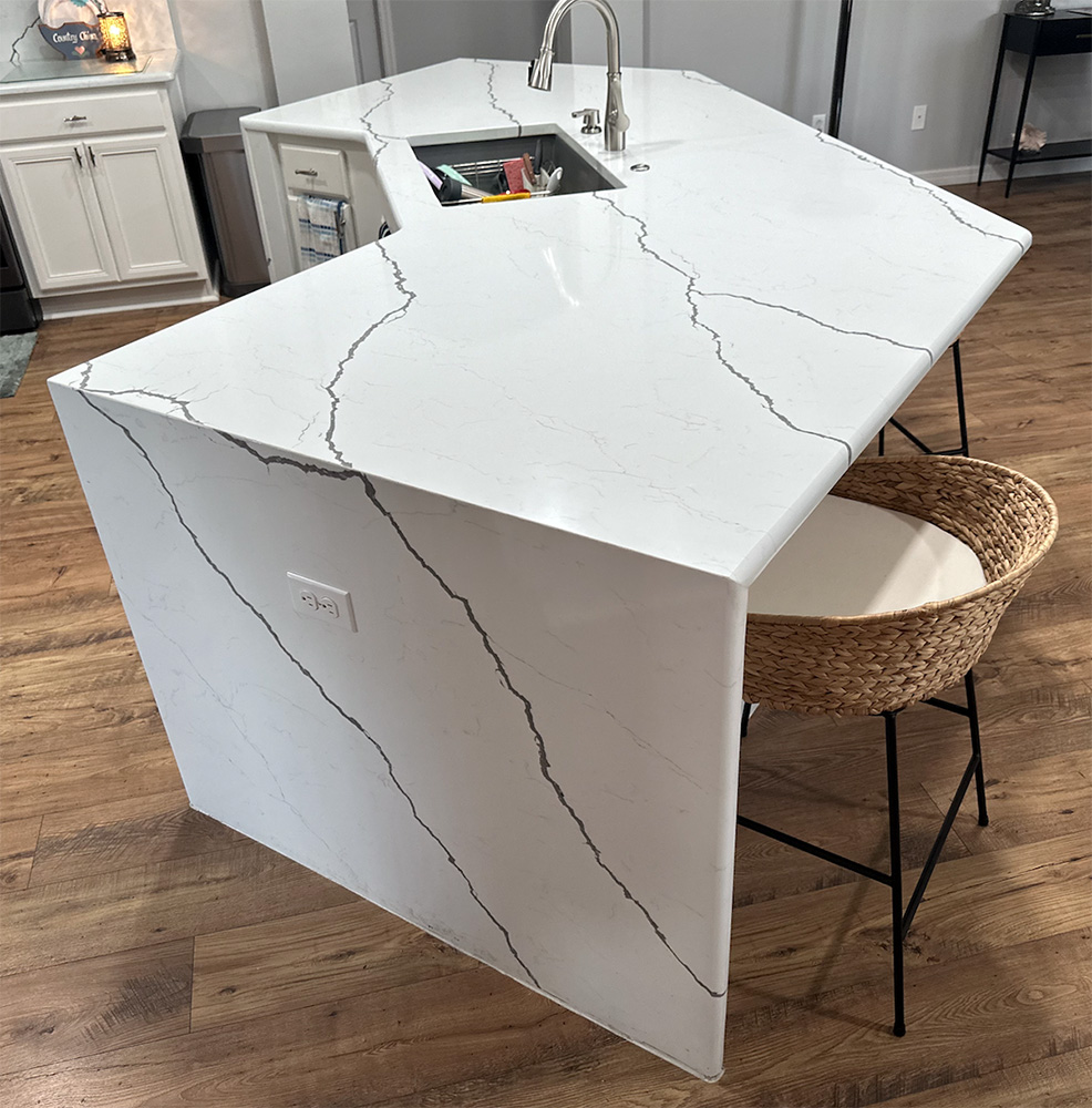 Modern kitchen island with marble countertop design.