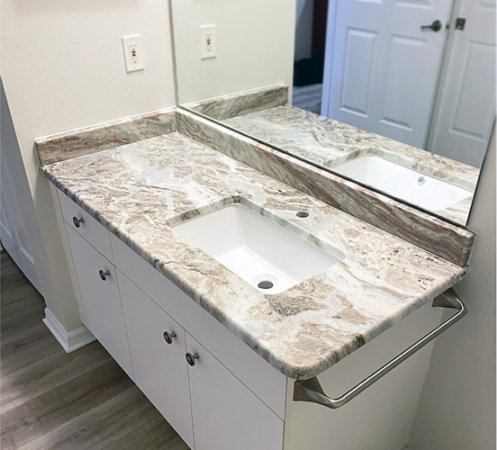 Modern double vanity bathroom sink with granite countertop.