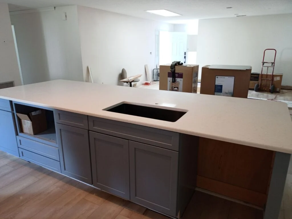 Modern kitchen under renovation with island.