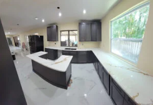 Modern kitchen with marble countertops.
