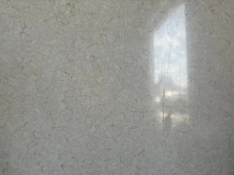 Textured marble wall with light reflection.