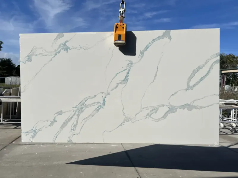 Large marble slab with blue veining outdoors.