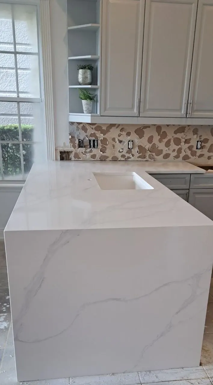 Modern kitchen with marble countertop and cabinets