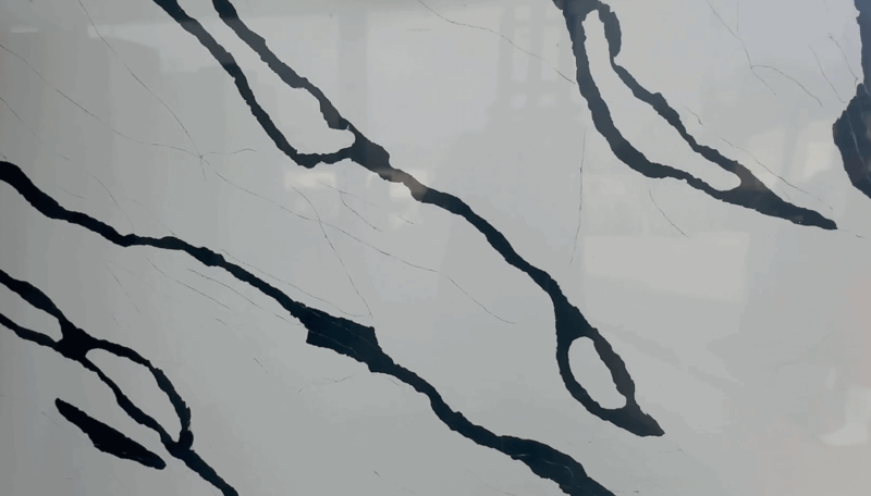 Close-up of marble countertop with dark veins.