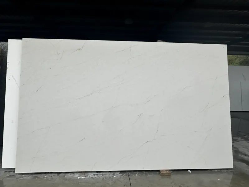 Large white marble slab with faint veining pattern.