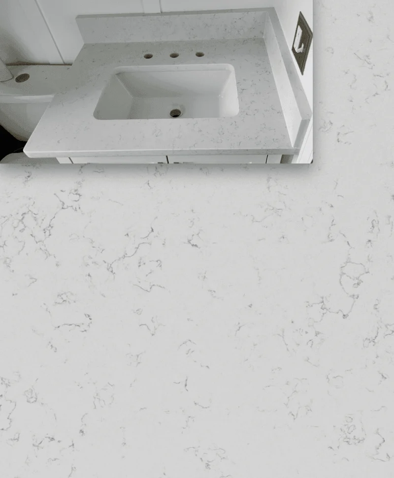 White marble bathroom countertop with sink.