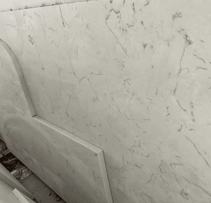 White marble slabs with dark veins in warehouse