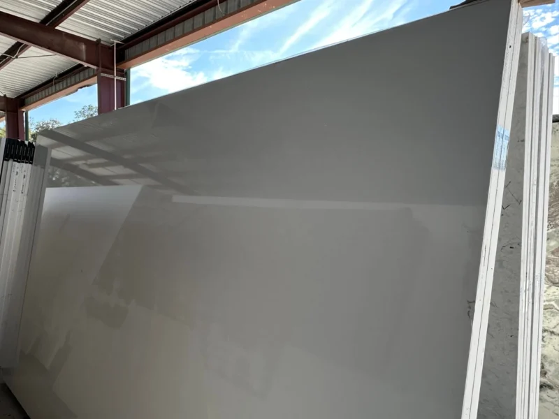 Large gray slabs stacked in a warehouse