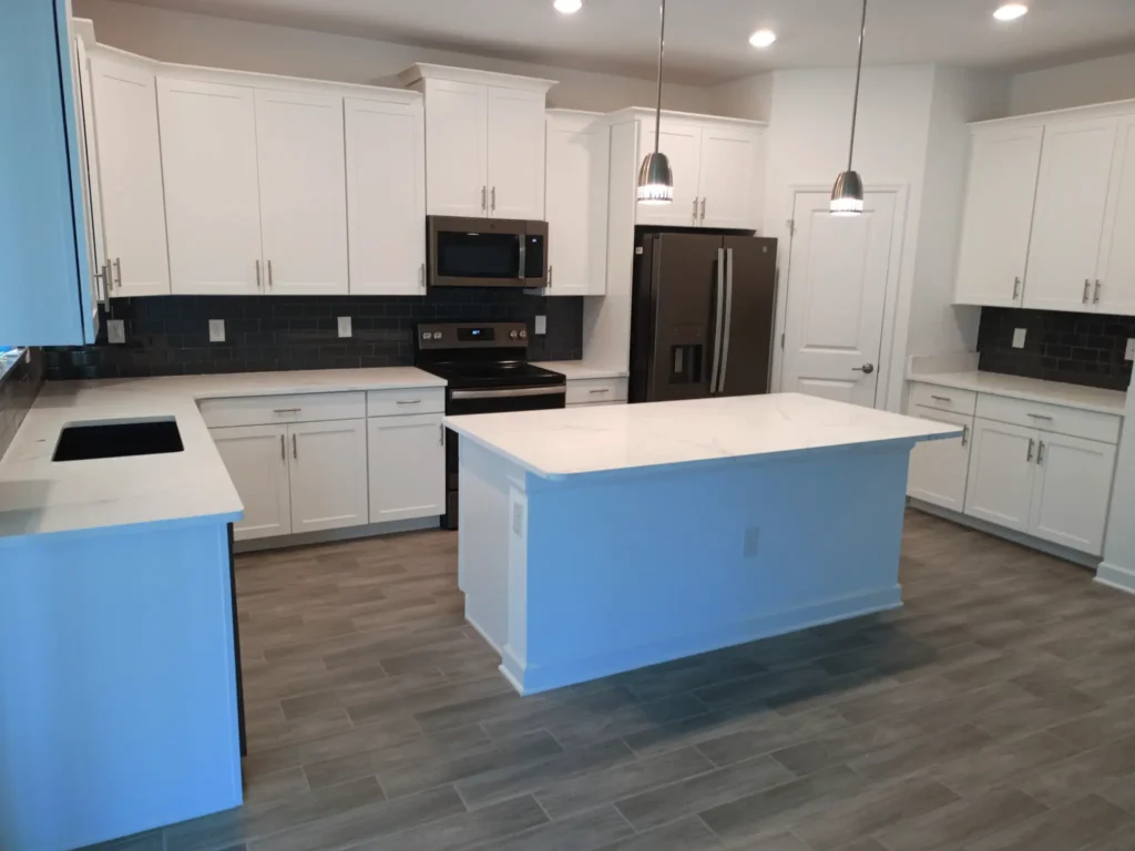 Modern kitchen with white cabinets and island