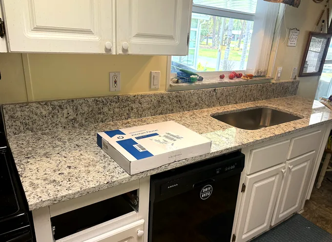 Ornamenal White Granite countertop kitchen — Edstone Orlando installation