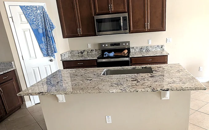 White Ice Granite countertop kitchen — Edstone Orlando installation