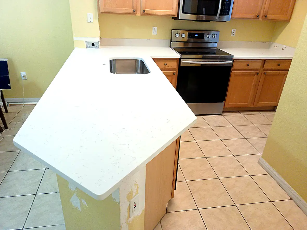 Carrara Quartz countertop kitchen — Edstone Orlando installation