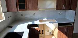 Calacatta Crema Marfil quartz kitchen countertops and island installed by EdStone in a Central Florida home