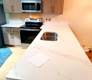Calacatta Midnight Lake Gold quartz kitchen countertops with heavy gold veining installed by EdStone in Orlando