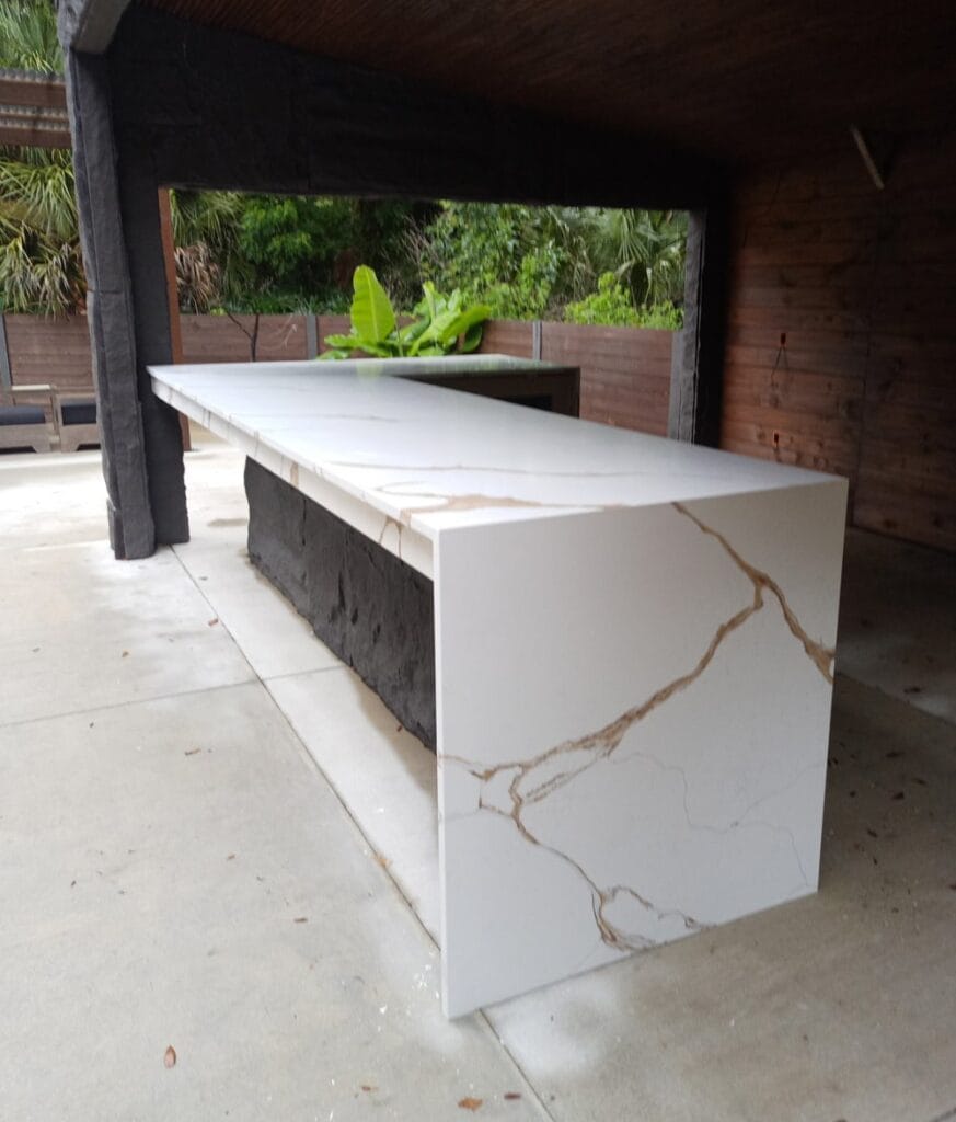 Custom quartz waterfall island countertop by EdStone in Central Florida