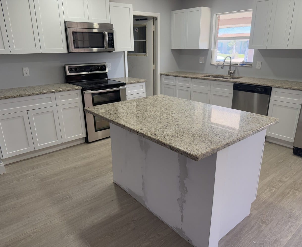 Custom granite kitchen countertops and island installed by EdStone in Orlando, Florida
