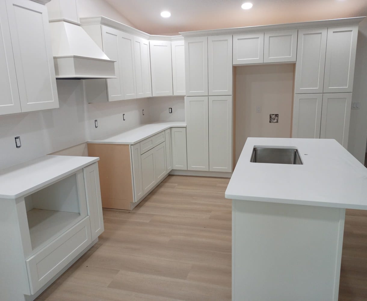 Bright white quartz kitchen countertops and island installed by EdStone in Orlando, Florida