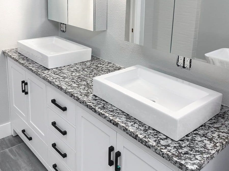 Granite double bathroom vanity with vessel sinks installed by EdStone in Orlando