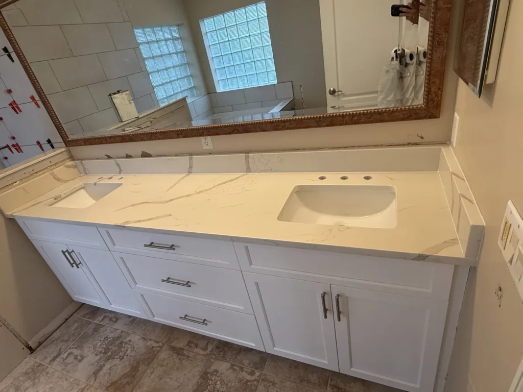 Calacatta Laza quartz primary bathroom countertop with undermount sinks