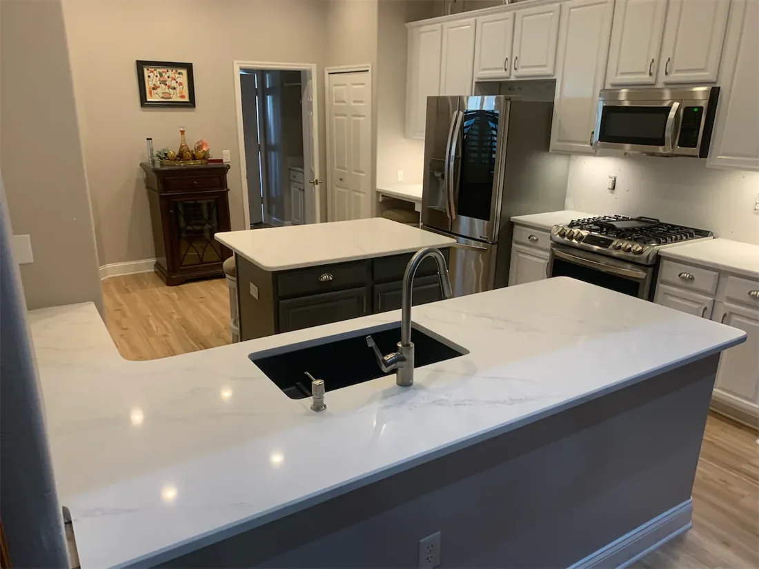 White kitchen countertops and island from the EdStone installation portfolio