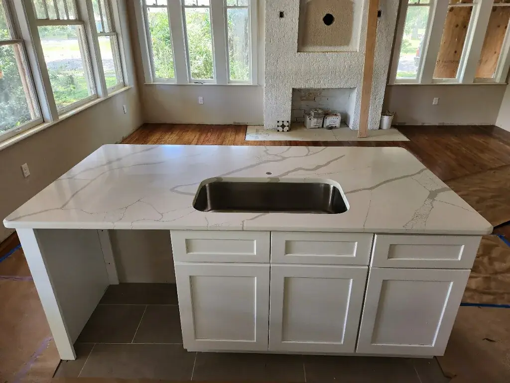 Veined countertop with undermount sink during an EdStone kitchen installation