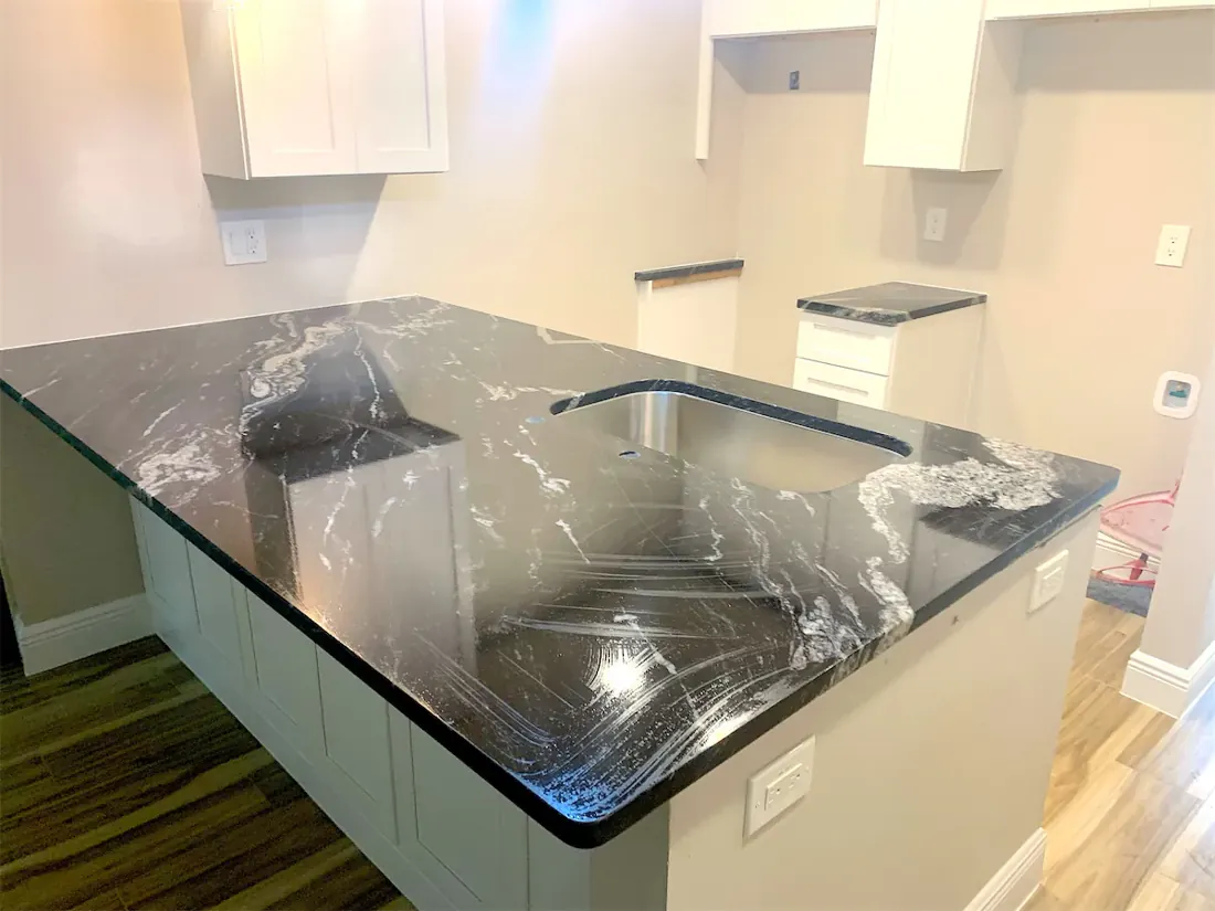 Dark veined countertop during an EdStone kitchen installation